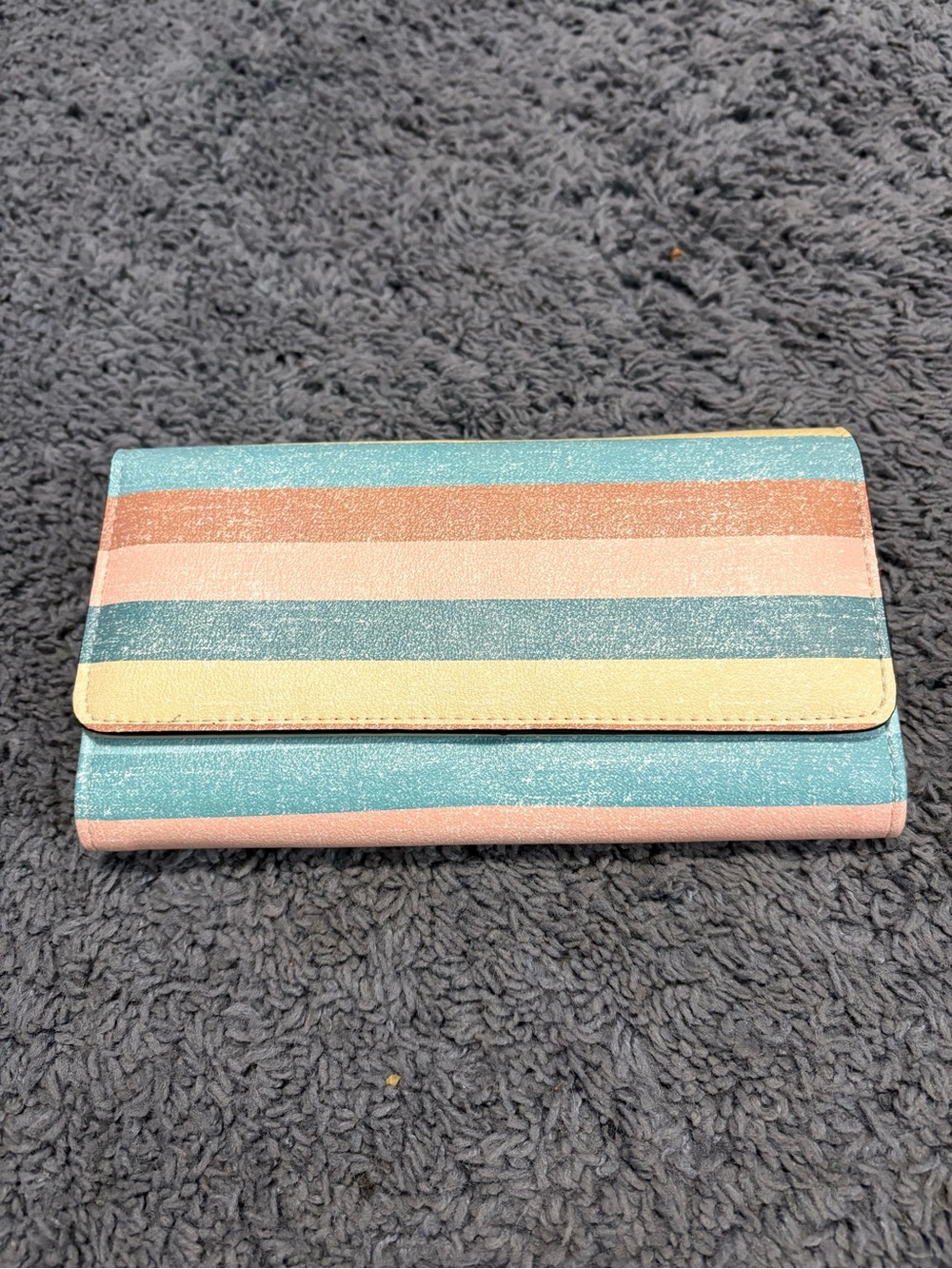NWOT striped wallet with sections on the inside for various things